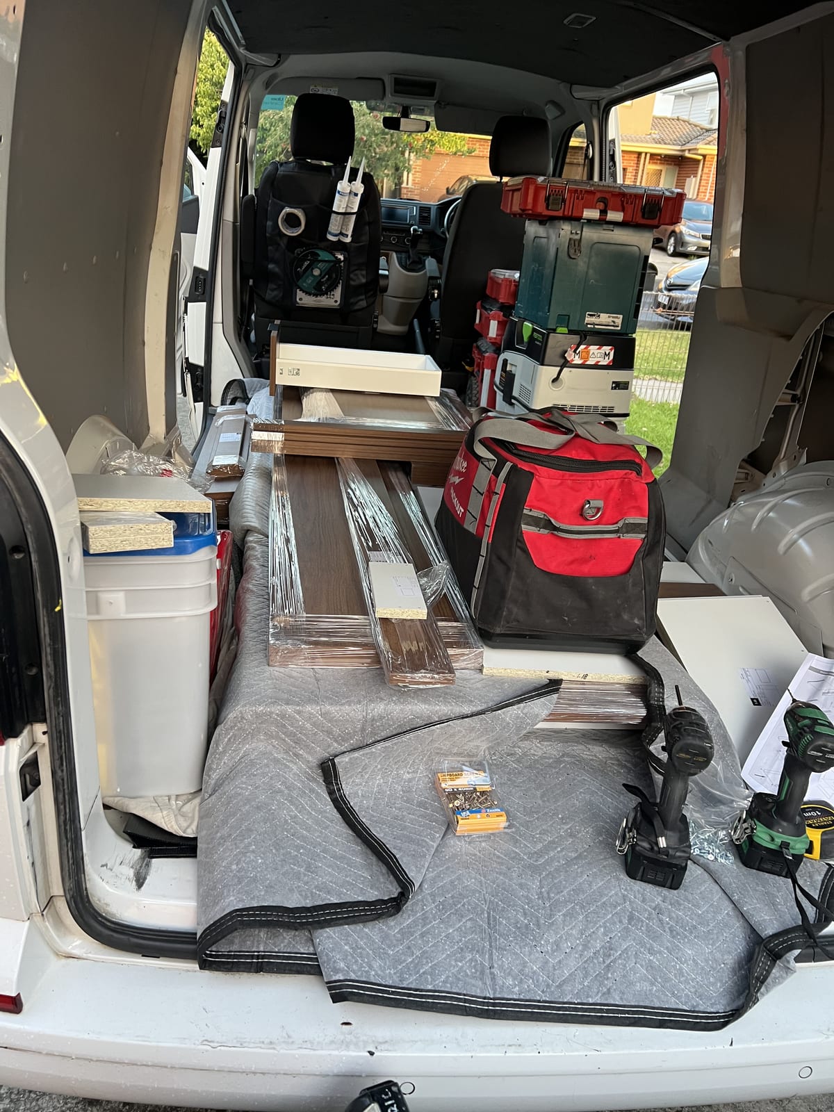 Van loaded with tools and materials for a kitchen facelift
