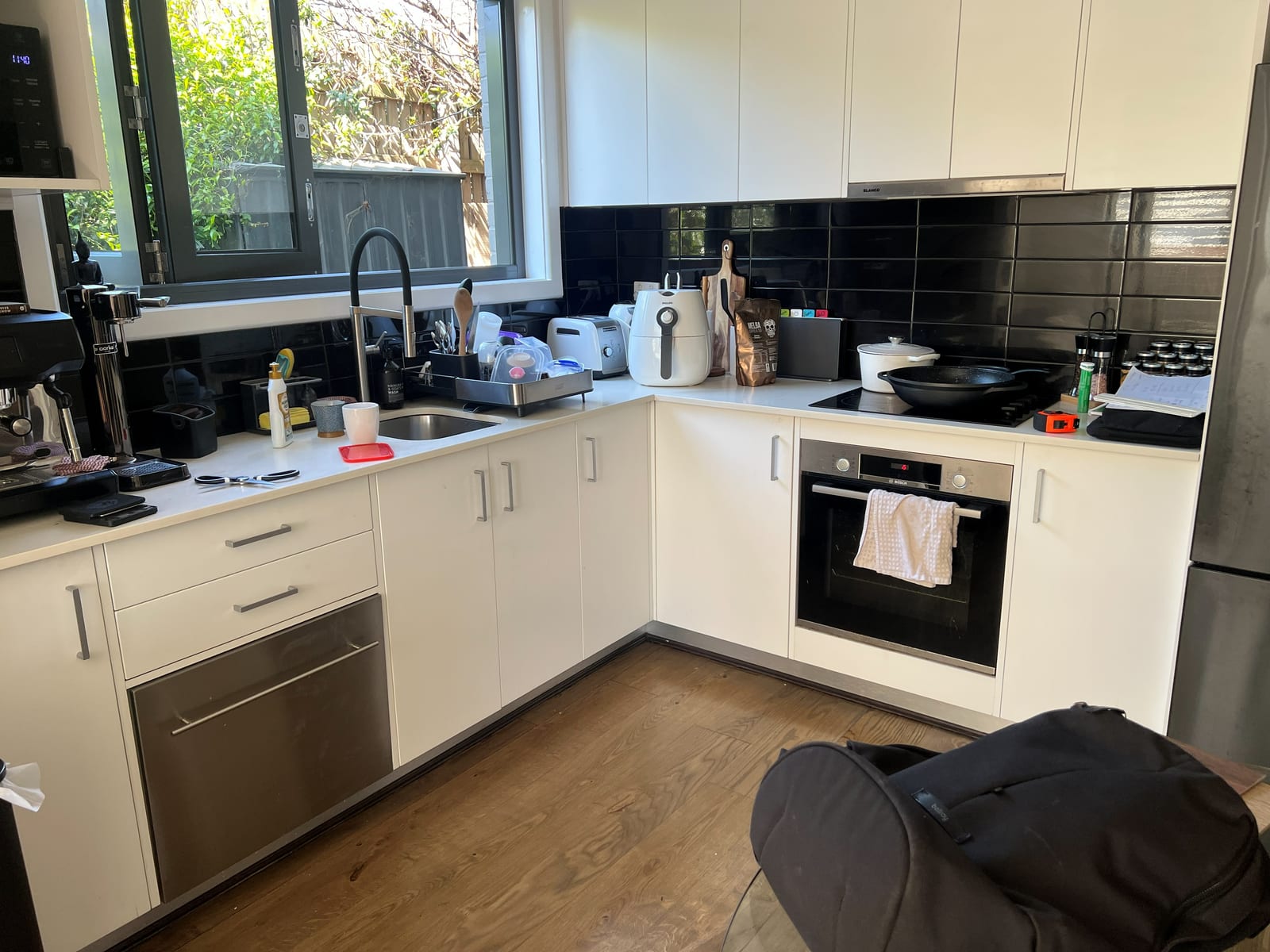 Kitchen before the facelift with original pale doors and drawer fronts