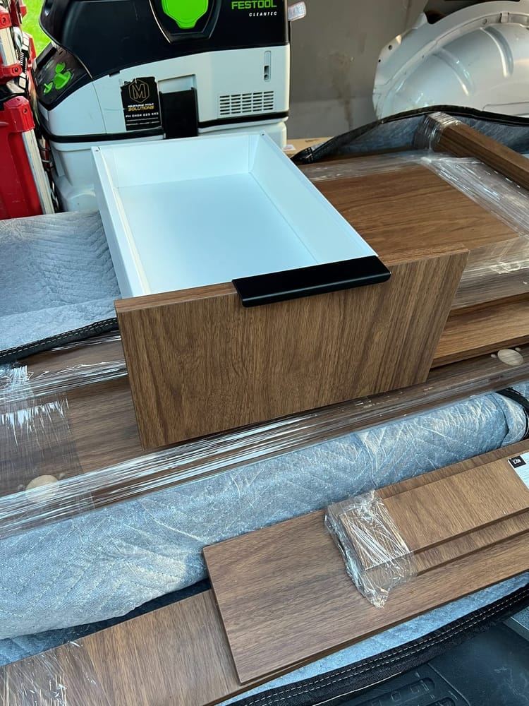 New doors, drawer fronts and end panels wrapped and stacked ready to be fitted