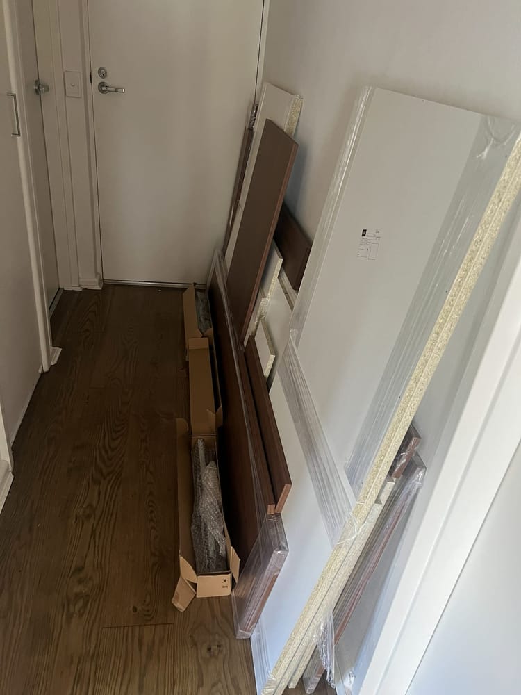New kitchen components delivered to the home and standing in the hallway before installation